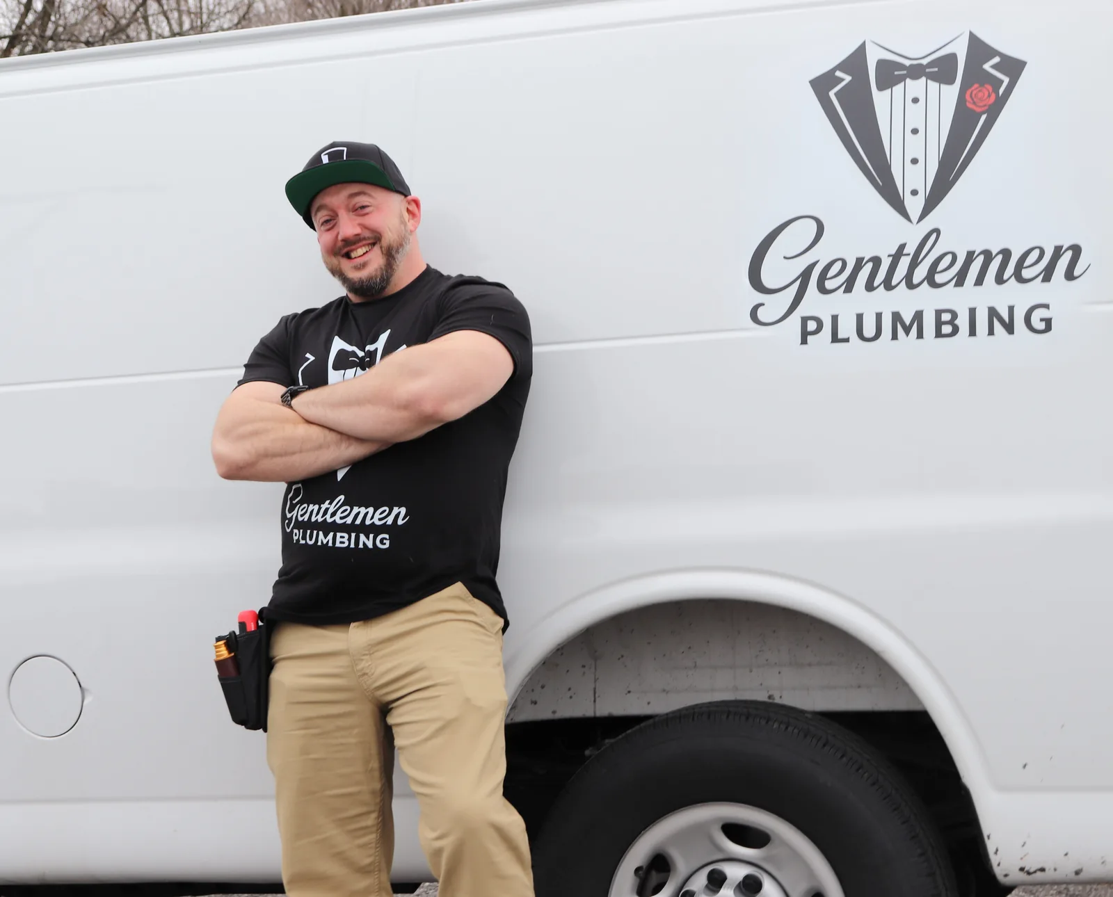 Gentlemen Plumbing technician standing in front of the service van