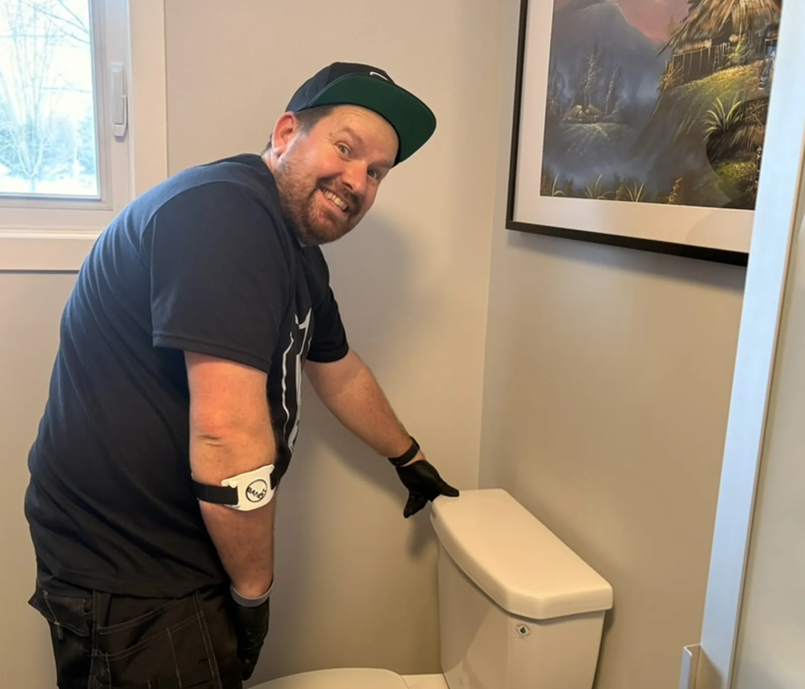 Gentlemen Plumbing plumber standing beside a toilet for installation planning.