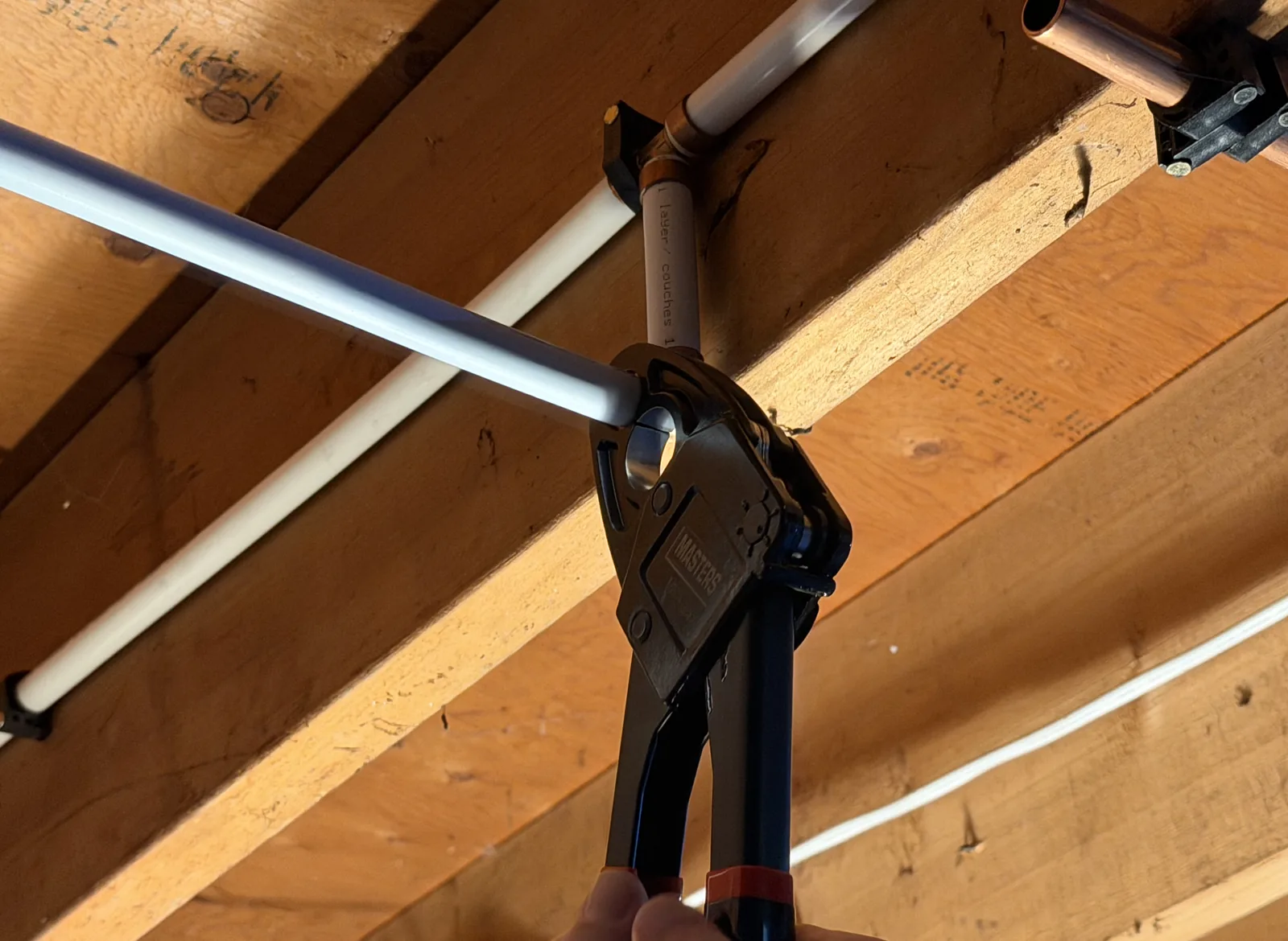 Gentlemen Plumbing plumber working on a water supply line in Ottawa.