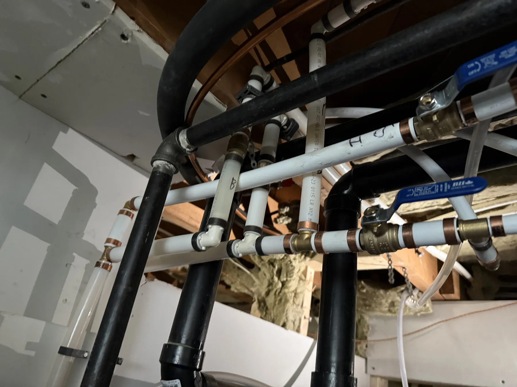 Ottawa plumbing waterline and drain piping in a renovation setting.